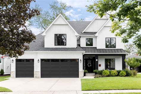 white house with dark metal windows|black windows white trim exterior.